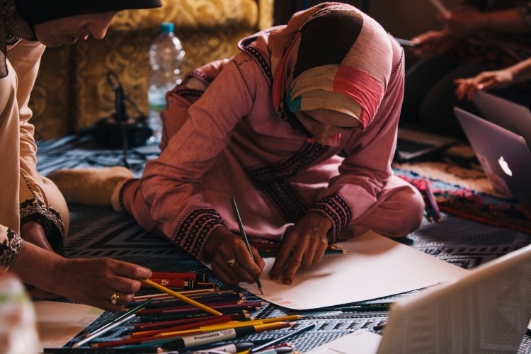 The artisans then selected five of their favorite colors from their favorite photo found on Pinterest and used them to create their color board.  Here, Fatima of the Imelghaus Cooperative creates her color board.  